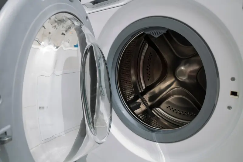 Front load washing machine with door open.