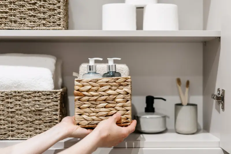 Bathroom items organized neatly on shelves.