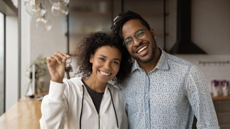 Couple in kitchen of vacation rental home.