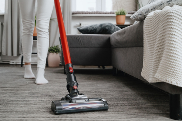 Woman vacuuming living room