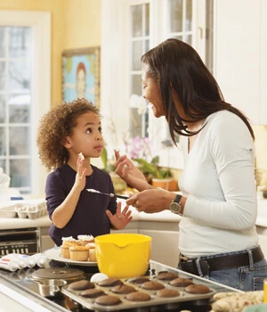 Mother and child baking in the kitchen