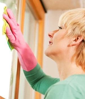 Woman cleaning a window